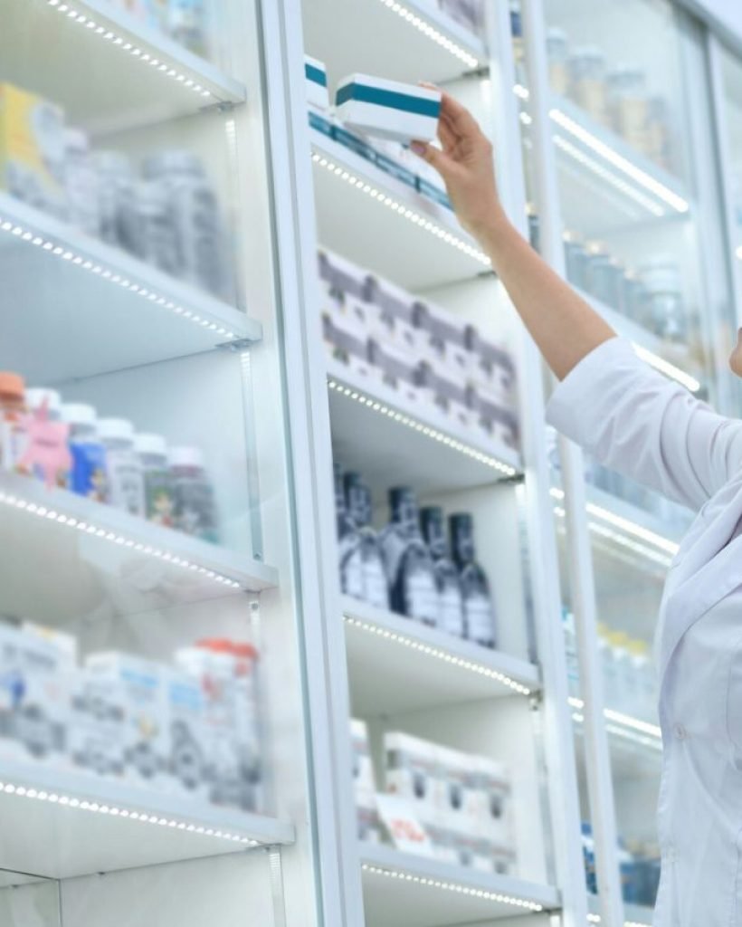 pharmaceutist-reaching-for-medications-on-pharmacy-shelves-e1714490013221.jpg